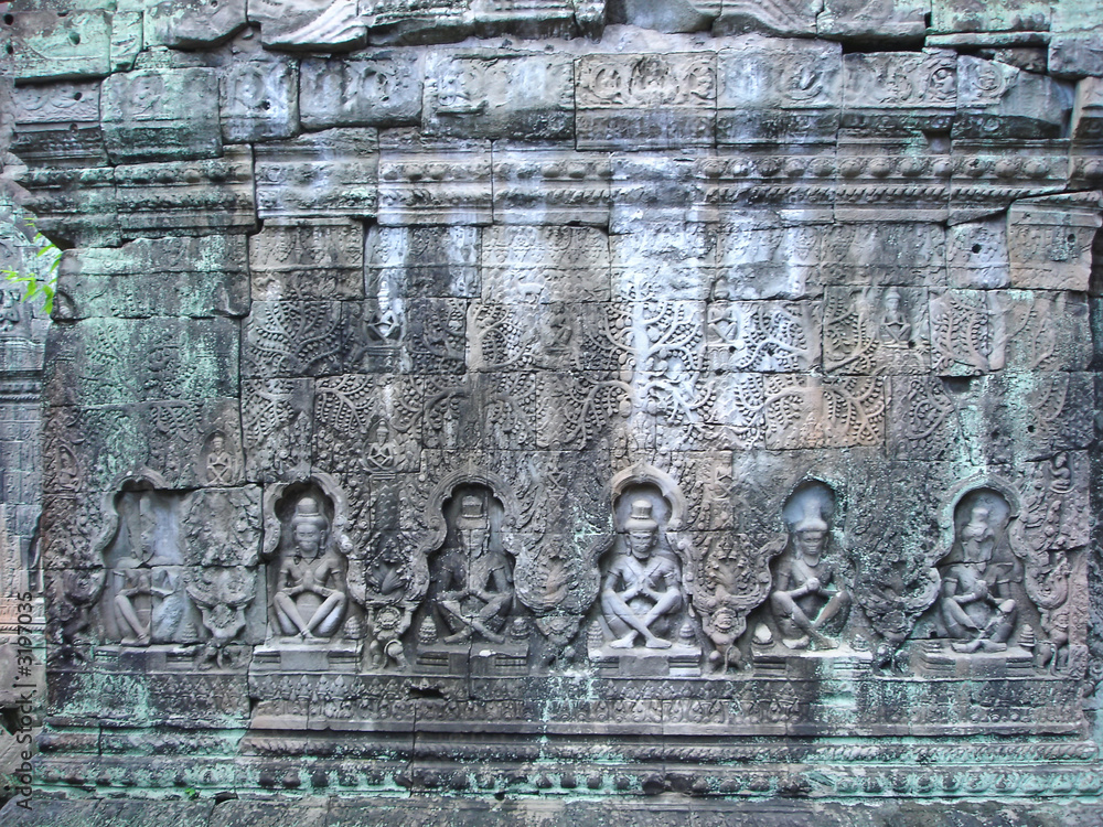 sculture of khmer art in old stone,  ta prohm, bayon, angkor tem