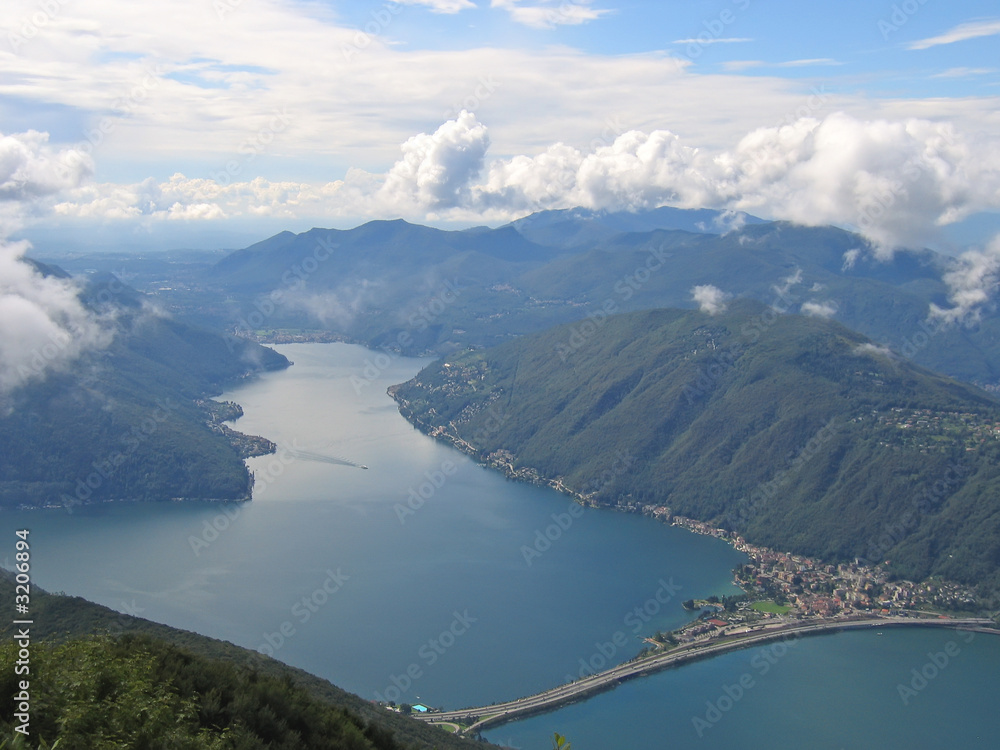 aerial view of a lake between the small alps mountains, come lak