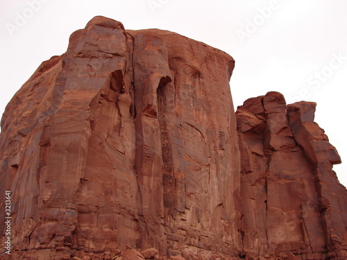 red rock cliff face in monument valley
