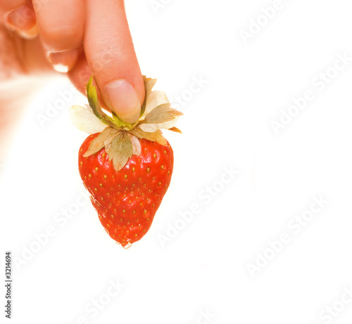 woman's hand with a fresh strawberry isolated on w