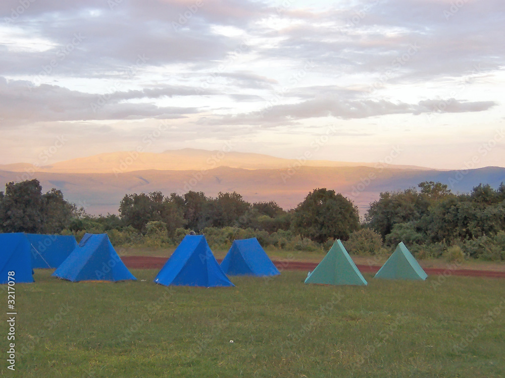 tent camp at the sunset in the african savanna, ngorongoro park,