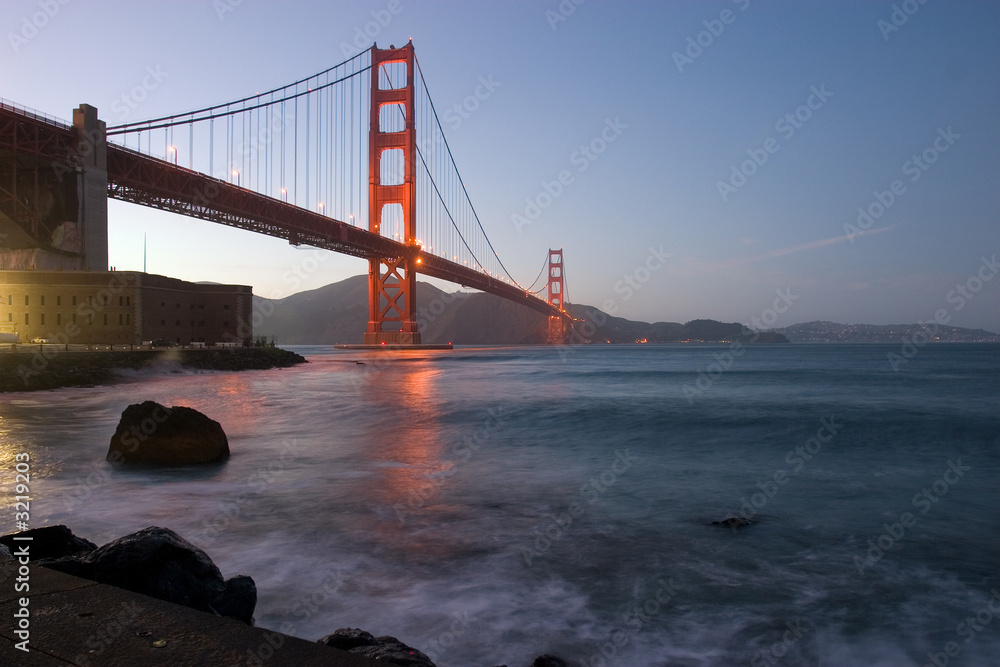 golden gate at dusk with reflection
