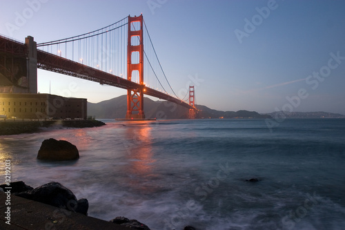 golden gate at dusk with reflection