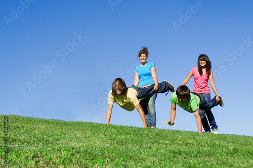 wheelbarrow race, youth having fun photo