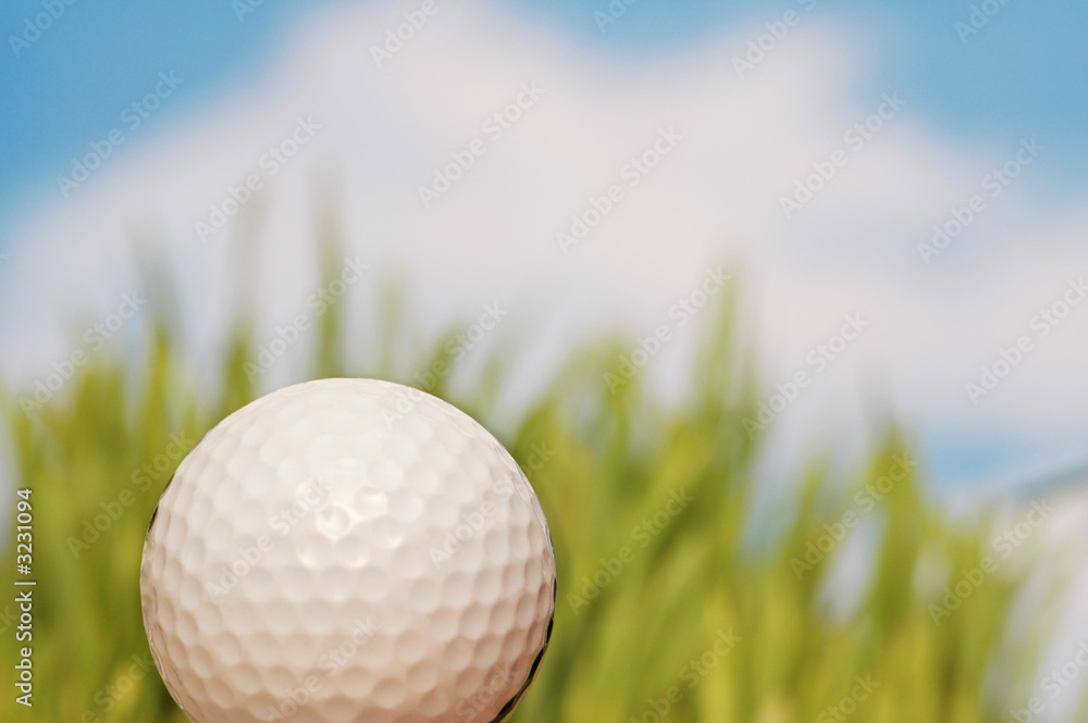 golf ball and green grass at the background golf ball and green grass at the background