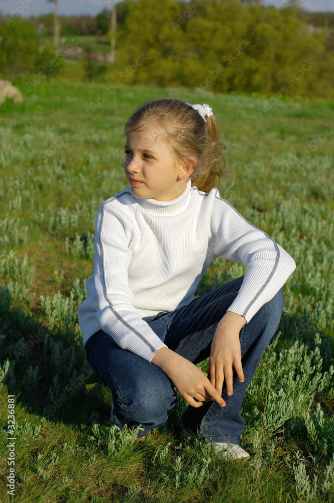 young blonde girl on the grass young blonde girl on the grass