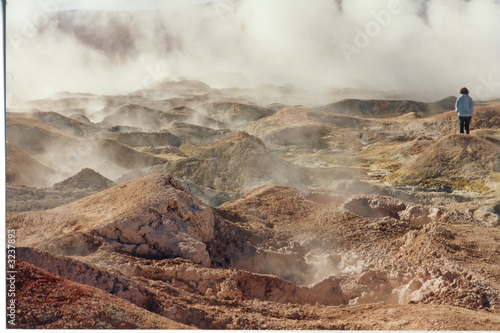 water hot geysers with smoke and steam, uyuni desert, bolivia