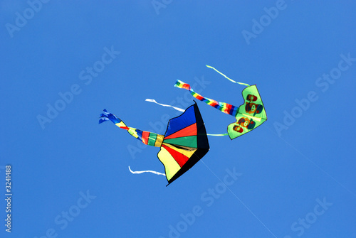 colorful kites flying in the blue skies