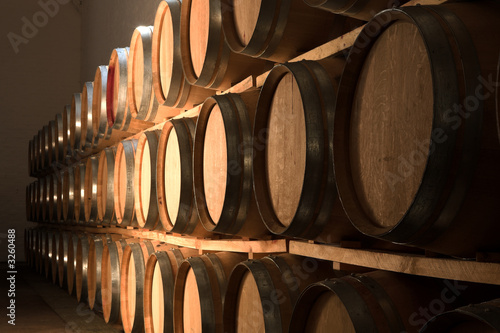 Photo oak barrels maturing red wine and brandy