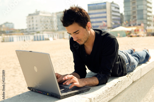 man with computer outdoor