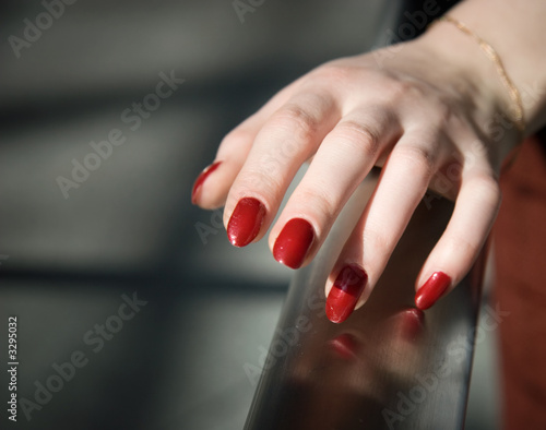 woman hand on a railing