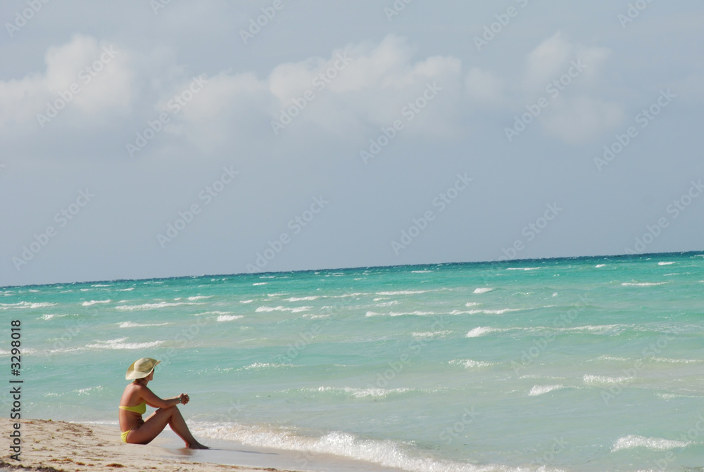 woman enjoying solitude on beach