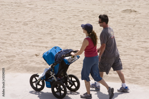 couple and baby stroller