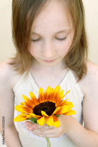 girl with yellow flower
