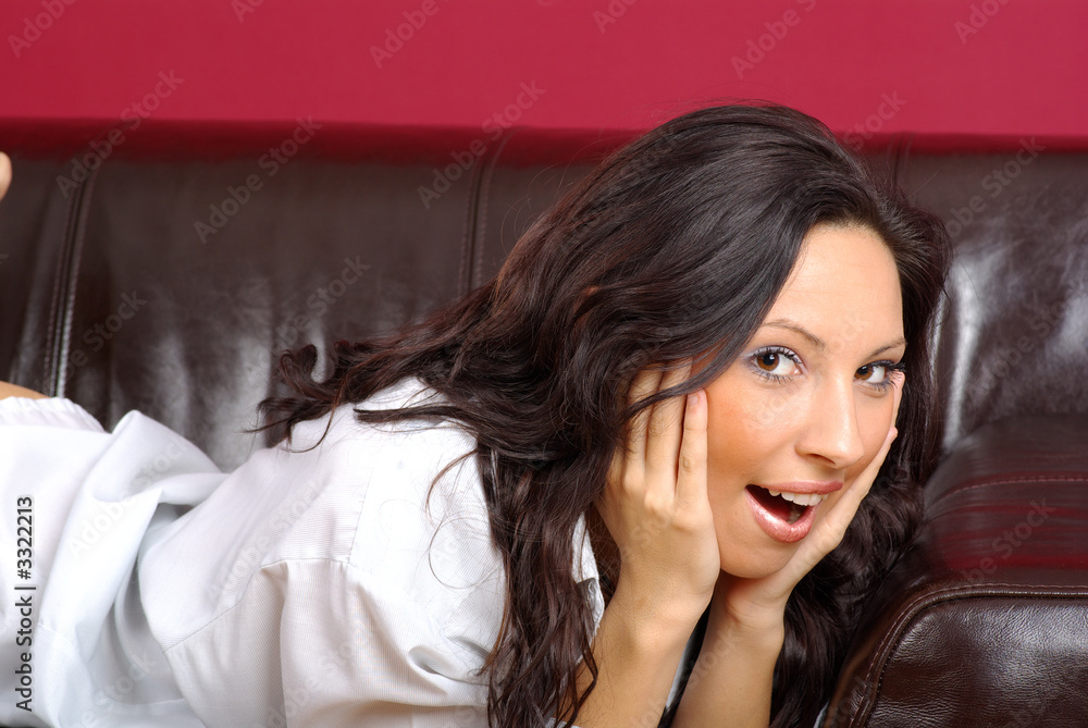 Sexy woman sitting on the sofa Sexy woman sitting on the sofa
