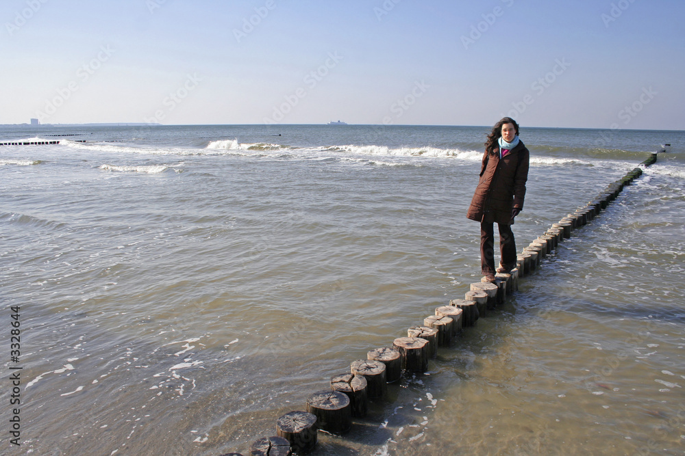 © paul prescott - young brunette walking on water