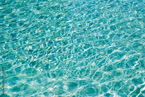 sunlight ripples on calm water