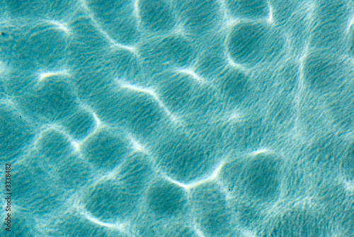sunlight ripples in aqua water