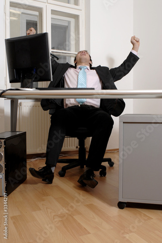 Winning businessman at desk