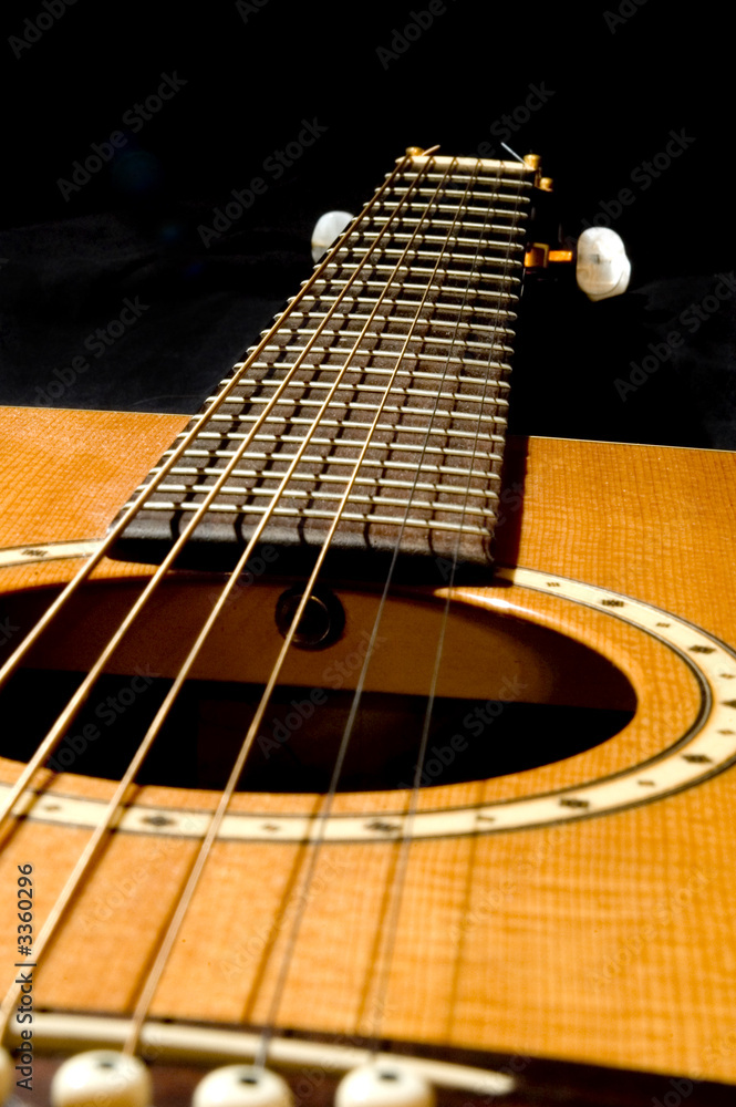 Obraz premium acoustic guitar on black 2