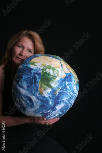 Pretty woman with globe