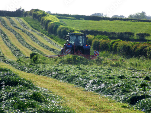 tractor spreading grass