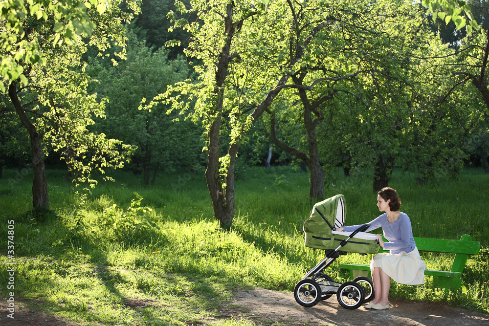 Obraz premium mother with baby carriage