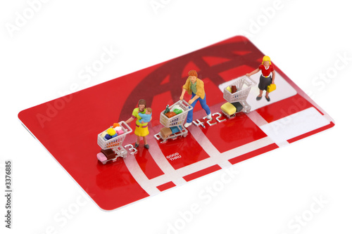 miniature shoppers on a credit card