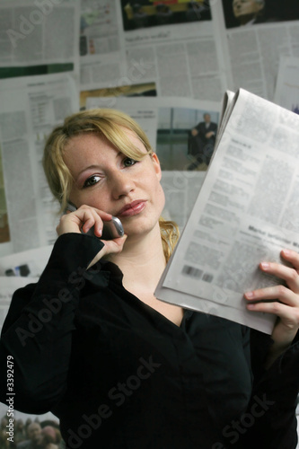 newspaper - businesswoman - mobile phone photo