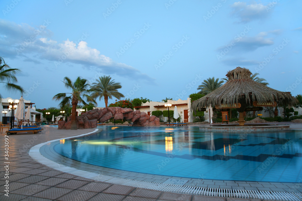 swimming pool in tropical hotel