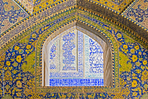 tiled background, oriental ornaments from isfahan mosque, iran photo