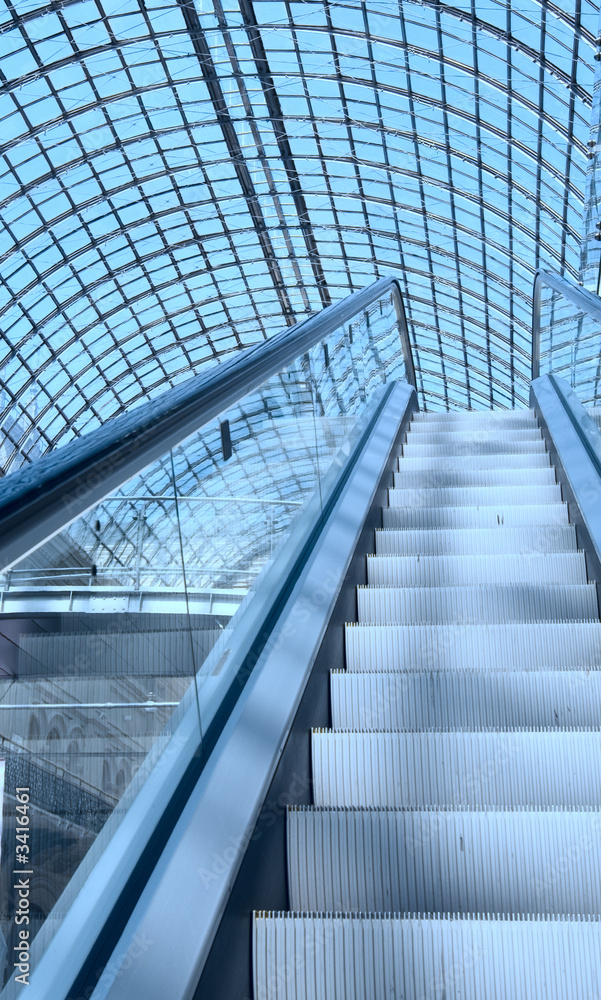 escalator in a shopping mall escalator in a shopping mall