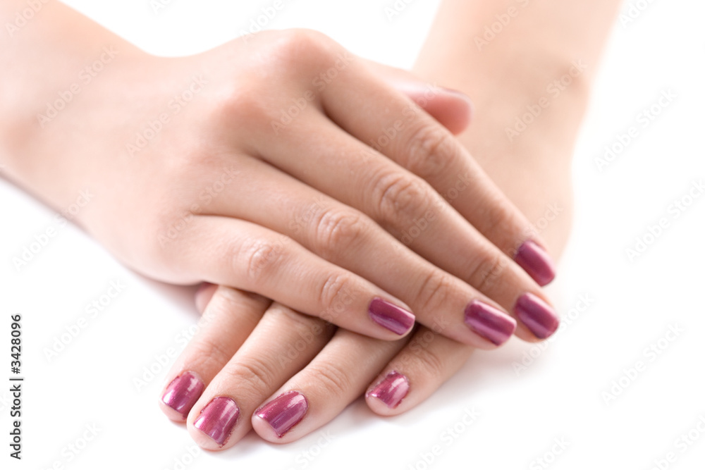 manicured female hands against white background manicured female hands against white background