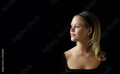 young woman with diamond and opel earings photo