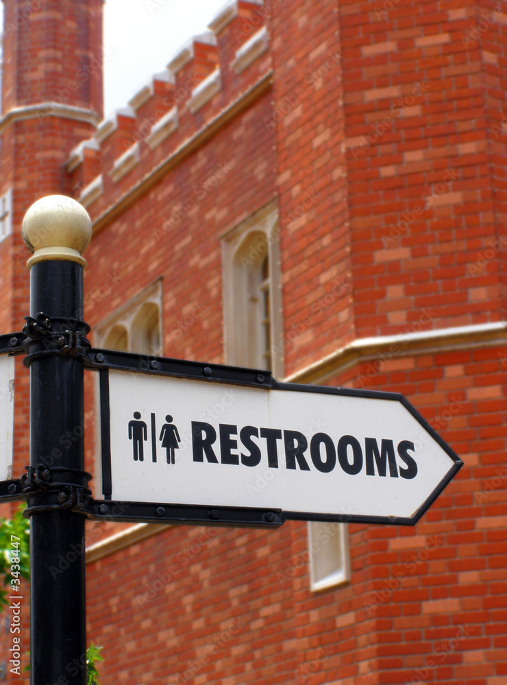 Obraz premium restroom direction sign