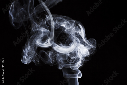 puff of aroma smoke on a dark background