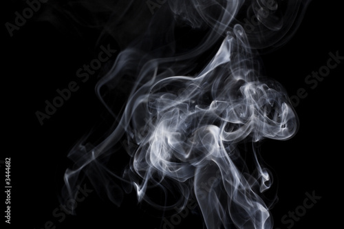puff of aroma smoke on a dark background