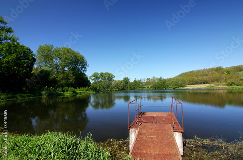 romantic spring/summer scenery with lake and sky