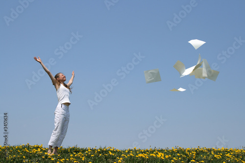 laughing girl frees herself from paperwork