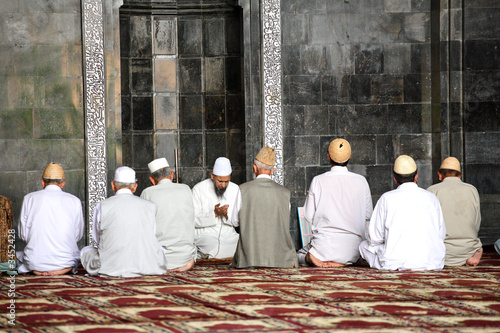 praying time in mosque. shrinagar, kashmir photo