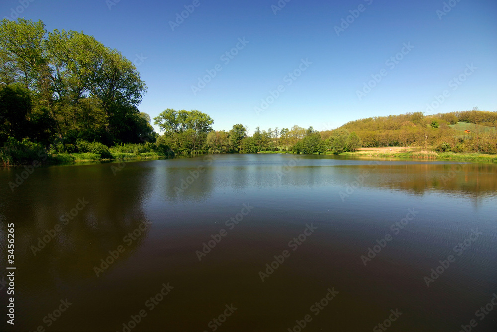 romantic spring/summer scenery with lake and sky romantic spring/summer scenery with lake and sky