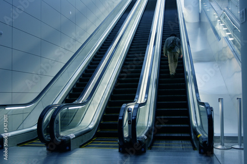 man on escalator