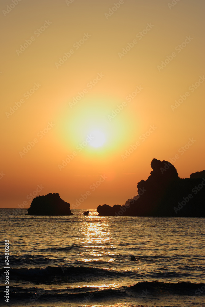 beautiful beach at sunset on corfu island, greece