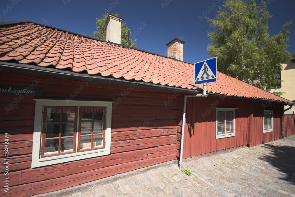 red swedish wooden house and sign