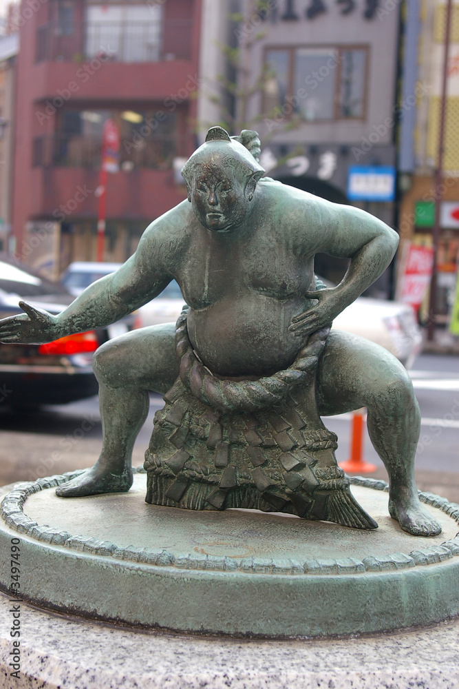 Naklejka premium cast metal sumo wrestler statue in Tokyo