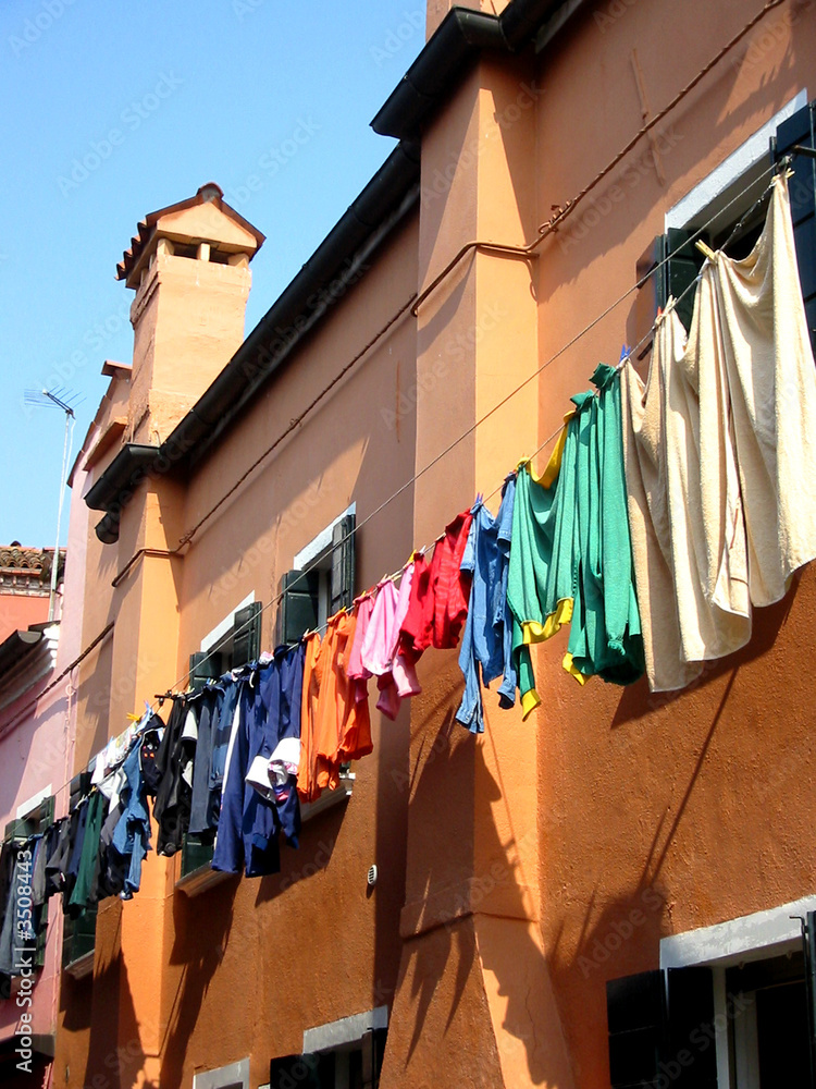 venice colourful clothes outside houses on burano