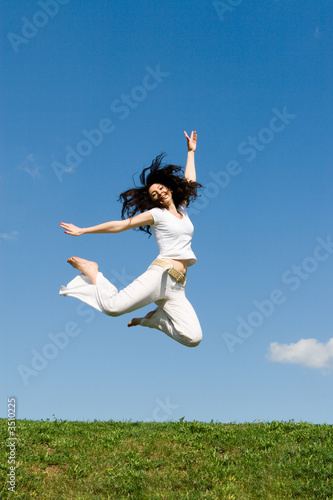 happy young woman is jumping