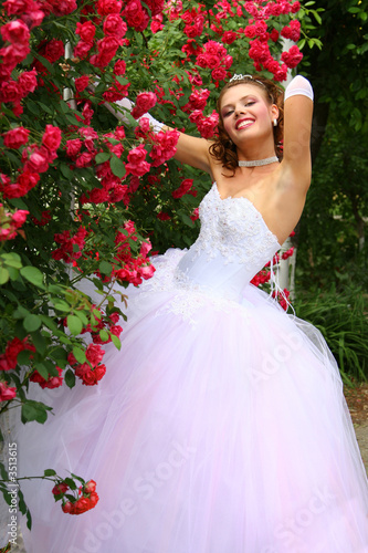 smiling bride in the red roses