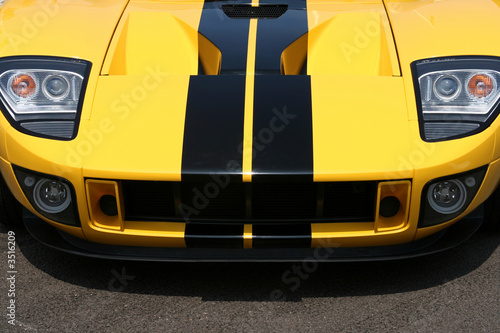 front of yellow supercar with black stripes photo