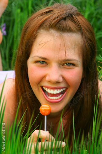 smiling girl with lollipop